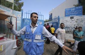United Nations worker gestures an Israeli air strike …