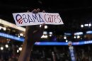 A delegate holds "Obama cares" bumper sticker during final session of Democratic National Convention in Charlotte