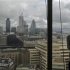 A man looks out at the view of London from the 14th floor of the Shard in London