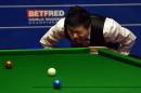 China's Ding Junhui takes part in his quarter-final match against Judd Trump of England in the World Snooker Championships at The Crucible in Sheffield, England on April 28, 2015