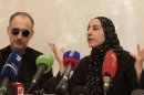 Zubeidat Tsarnaeva, the mother of the Boston bombing suspects, and the suspects' father Anzor Tsarnaev, speak at a news conference in Dagestan on April 25.