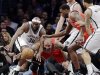 Brooklyn Nets forward Reggie Evans (30) and Chicago Bulls forward Carlos Boozer (5) go for a loose ball in the first half of Game 2 of their first-round NBA basketball playoff series, Monday, April 22, 2013, in New York. (AP Photo/Kathy Willens)