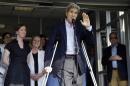 Secretary of State John Kerry waves after speaking to media as he is discharged from Massachusetts General Hospital Friday, June 12, 2015, in Boston. Kerry was released from the hospital after undergoing surgery on a broken leg sustained in a May 31 bicycle accident in France. (AP Photo/Elise Amendola)