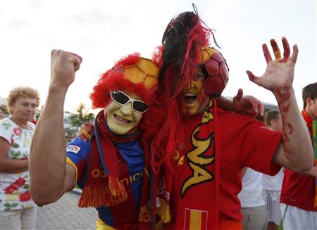 Spain's fans cheer before their Euro 2012 semi-final soccer match against Portugal in Donetsk