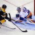 Boston Bruins' center Patrice Bergeron scores a goal against New York Islanders' goaltender Rick DiPietro in the third period of their NHL hockey game in Boston