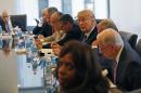 Republican presidential candidate Donald Trump, center, participates in a roundtable discussion on national security in his offices in Trump Tower in New York, Wednesday, Aug. 17, 2016. (AP Photo/Gerald Herbert)