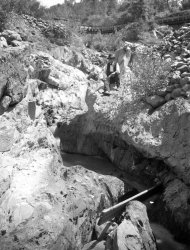 In this 1905 photo provided by the U.S. Geological Survey is a channel in bedrock worn by tailings of the Cherokee hydraulic mine in Butte County, Calif. Across the West, early miners digging for gold, silver and copper had no idea that one day something even more valuable would be hidden in the piles of dirt and rocks they tossed aside. Now there’s a rush in the U.S. to find key components of cellphones, televisions, weapons systems, wind turbines, MRI machines and the regenerative brakes in hybrid cars, a group of versatile minerals on the periodic table called rare earth elements and old mining tailings piles just might be the answer. (AP Photo/U.S. Geological Survey)