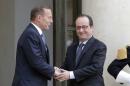 French President Francois Hollande, right, sees off Australian Prime Minister Tony Abbott after their meeting at the Elysee Palace in Paris, France, Monday, April 27, 2015. (AP Photo/Francois Mori)