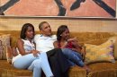 FILE - In this Sept. 4, 2012 file image originally released by the White House, President Barack Obama and his daughters, Malia, left, and Sasha, watch first lady Michelle Obama speak at the Democratic National Convention on television from the Treaty Room of the White House. For many TV viewers, who may not have seen much of the Obama girls since election night or the convention four years ago, it will surely be a surprise to see how much the Obama daughters have grown when they appear in Charlotte Thursday night. (AP Photo/The White House, Pete Souza, file)