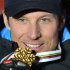 Norway's Aksel Lund Svindal poses with his gold medal during the medal ceremony after the men's downhill race at the Alpine skiing world championships in Schladming, Austria, Saturday Feb. 9, 2013. (AP Photo/Kerstin Joensson)