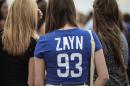 Supporters of the boy band One Direction arrive on March 28, 2015 at the FNB Stadium in Johannesburg for the first concert of their South African tour