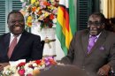 Zimbabwean President Robert Mugabe and Prime Minister Morgan Tsvangirai address a media conference at State House in the capital Harare
