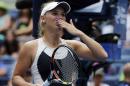 Caroline Wozniacki, of Denmark, blows kisses to the crowd after beating Jamie Loeb, of the United States, during the first round of the U.S. Open tennis tournament, Tuesday, Sept. 1, 2015, in New York. (AP Photo/Charles Krupa)