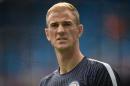 Manchester City's English goalkeeper Joe Hart warms up before the English Premier League football match between Manchester City and West Ham United at the Etihad Stadium in Manchester, north west England
