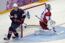 USA forward T.J. Oshie scores a goal in a shootout against Russia during a men's ice hockey game at the 2014 Winter Olympics, Saturday, Feb. 15, 2014, in Sochi, Russia. (AP Photo/Petr David Josek)