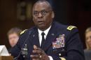 In this Sept. 16, 2015, photo, U.S. Central Command Commander Gen. Lloyd Austin III, testifies on Capitol Hill in Washington. The Obama administration is preparing a major overhaul of its failed effort to train thousands of moderate Syrian rebels to fight the Islamic State group, shifting from preparing rebels for frontline combat to a plan to embed them with established Kurdish and Arab forces in northeastern Syria, U.S. officials said. The discussion of a new approach comes a day after Austin, told Congress that the $500 million effort to train 5,000 moderate Syrian rebels in a year had yielded "four or five" new fighters after another 50 or so were captured, wounded or fled in their first encounter with extremist militants. (AP Photo/Pablo Martinez Monsivais)