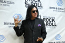 Gene Simmons, the lead singer of the rock band Kiss, makes an unannounced appearance at a fundraiser concert at the Brennan Rock & Roll Academy, Saturday, Mar. 30, 2013, in Sioux Falls, S.D. (AP Photo/Dirk Lammers)