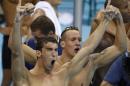 Michael Phelps (L) and Caeleb Dressel celebrate after team USA won the men's 4x100m freestyle relay