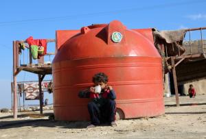A Syrian boy drinks tea in the Al-Shallal suburb of &hellip;