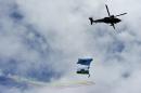 A helicopter of the Armed Forces flies during a military parade to celebrate Colombia's Independence Day, in Bogota, on July 20, 2015