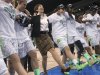 Notre Dame coach Muffet McGraw, center, dances with her players as they celebrate an 87-76 win over Duke in the regional final of the NCAA women's college basketball tournament Tuesday, April 2, 2013, in Norfolk, Va. (AP Photo/Jason Hirschfeld)