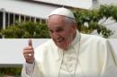 Pope Francis gives a thumbs up from the popemobile in Quito, on July 7, 2015