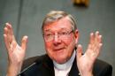 Cardinal George Pell gestures as he talks during a news conference for the presentation of new president of Vatican Bank IOR, at the Vatican