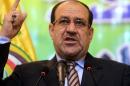 A picture taken on January 11, 2014 in Baghdad shows Iraqi Prime Minister Nuri al-Maliki speaking during a political meeting