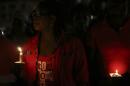 People hold candles during an interfaith vigil praying for the release of abducted Nigerian schoolgirls, in Lagos