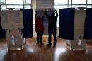 Members of a local electoral commission prepare a polling station ahead of Russia's parliamentary elections, in Moscow on September 17, 2016