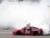 Matt Kenseth (20) performs a burnout after winning the NASCAR Sprint Cup Series auto race at Kansas Speedway in Kansas City, Kan., Sunday, April 21, 2013. (AP Photo/Orlin Wagner)