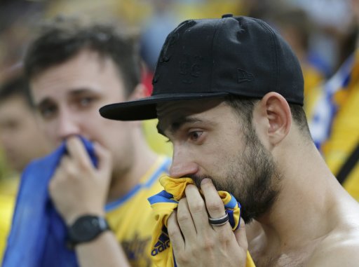 Ukraine's fans react after their lost Group D Euro 2012 soccer match against England at the Donbass Arena in Donetsk