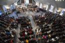The presentation of the flags of the nations is performed before the start of the Rev. Martin Luther King Jr. holiday commemorative service at Ebenezer Baptist Church Monday, Jan. 20, 2014, in Atlanta. (AP Photo/Jason Getz)