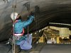 A worker inspects the structure inside the 1.65-kilometer (1-mile) Tsuburano Tunnel on the Tomei Expressway in Yamakitamachi, Kanagawa Prefecture, eastern Japan, Monday, Dec. 3, 2012. Concrete ceiling panels fell onto moving vehicles deep inside a tunnel on another expressway in Japan Sunday, and authorities confirmed nine deaths before suspending rescue work Monday while the roof was being reinforced to prevent more collapses. (AP Photo/Kyodo News) JAPAN OUT, MANDATORY CREDIT, NO LICENSING IN CHINA, FRANCE, HONG KONG, JAPAN AND SOUTH KOREA
