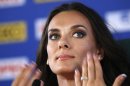 Russia's Yelena Isinbayeva, the gold medalist in the women's pole vault, gestures during a press conference at the World Athletics Championships in the Luzhniki stadium in Moscow, Russia, Thursday, Aug. 15, 2013. (AP Photo/Alexander Zemlianichenko)