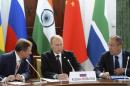 Russia's President Vladimir Putin, Foreign Minister Sergei Lavrov and Chief of Staff of the Presidential Administration Sergei Ivanov attend a BRICS leaders' meeting at the G20 Summit in Strelna near St. Petersburg