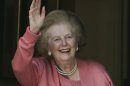 FILE- Former British Prime Minister Margaret Thatcher, gestures to members of the media following her return home from hospital suffering from a broken arm, in central London, in this file photos dated Monday June 29, 2009. 87-year old Thatcher is recuperating at an unnamed hospital, Friday Dec. 21, 2012, after an operation to remove a bladder growth, which was "completely satisfactory", according to adviser Tim Bell, who did not give further details. (AP Photo/Lefteris Pitarakis, File)