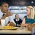 President Barack Obama visits Emily Young, first time voter, and student and University of Miami  at OMG Burger, Thursday, Sept. 20, 2012, in Miami, Fla.  (AP Photo/Carolyn Kaster)