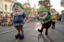 File photo of Disney characters the "Seven Dwarfs" walking along Main Street during a parade at Disneyland in Anaheim.