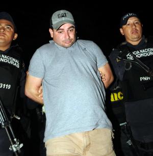 Honduran police escort Plutarco Ruiz -- the boyfriend …