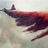A Cal Fire aircraft drops flame retardant on the Topaz Ranch Estates Fire in Wellington
