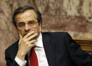 <p>               Greek Prime Minister Antonis Samaras looks on during a debate on the new government's policy agenda before staging a vote of confidence  at the parliament in Athens, late Sunday July 8, 2012. (AP Photo/Kostas Tsironis)