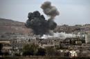 Smoke rises from the the Syrian town of Kobane on October 14, 2014