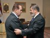 In this photo released by Middle East News Agency, the Egyptian official news agency, caretaker Prime Minister Kamal el-Ganzouri, left, shakes hands with newly elected President Mohammed Morsi in Cairo, Egypt, Monday, June 25, 2012. Morsi met with the military-backed Prime Minister el-Ganzouri, who resigned Monday and was asked to head a caretaker government until Morsi nominates a new one. The election of an Islamist president in Egypt is turning longstanding U.S. policy in the Mideast inside out. The Obama administration is relieved that the candidate who represents three decades of close partnership with the United States was beaten by an Islamic fundamentalist. (AP Photo/Middle East News Agency, HO)