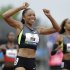 Allyson Felix celebrates her first place finish in the women's 200 meters at the U.S. Olympic Track and Field Trials Saturday, June 30, 2012, in Eugene, Ore. (AP Photo/Eric Gay)