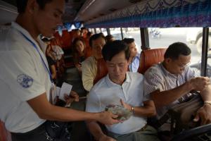 A commuter buys a ticket on a public in Phnom Penh&nbsp;&hellip;