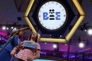 Richelle Zampella is escorted to the microphone during the 2013 Scripps National Spelling Bee at the Gaylord National Resort and Convention Center at National Harbor in Maryland