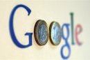 An illustration picture shows a Google logo with two one Euro coins