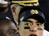 In this Nov. 17, 2012, photo, Notre Dame linebacker Manti Te'o sings the alma mater following their NCAA college football game against Stanford in South Bend, Ind. A story that Te'o's girlfriend had died of leukemia _ a loss he said inspired him to help lead the Irish to the BCS championship game _ was dismissed by the university Wednesday, Jan. 16, 2013, as a hoax perpetrated against the linebacker. (AP Photo/Joe Raymond)