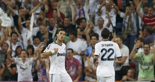 Real Madrid's Ronaldo celebrates his goal against Barcelona with team mate Di Maria during their Spanish Super Cup second leg soccer match in Madrid